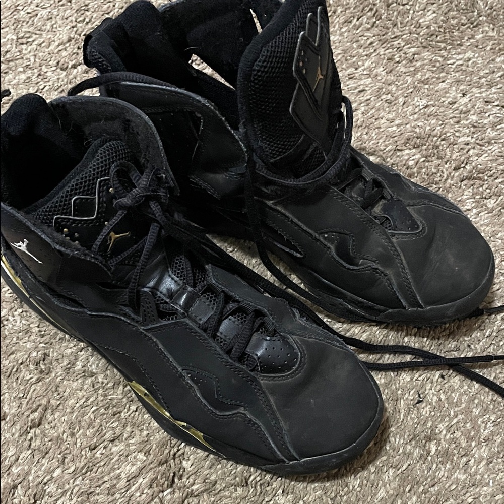 Nike Jordan Black and Gold High-Top Athletic Shoes